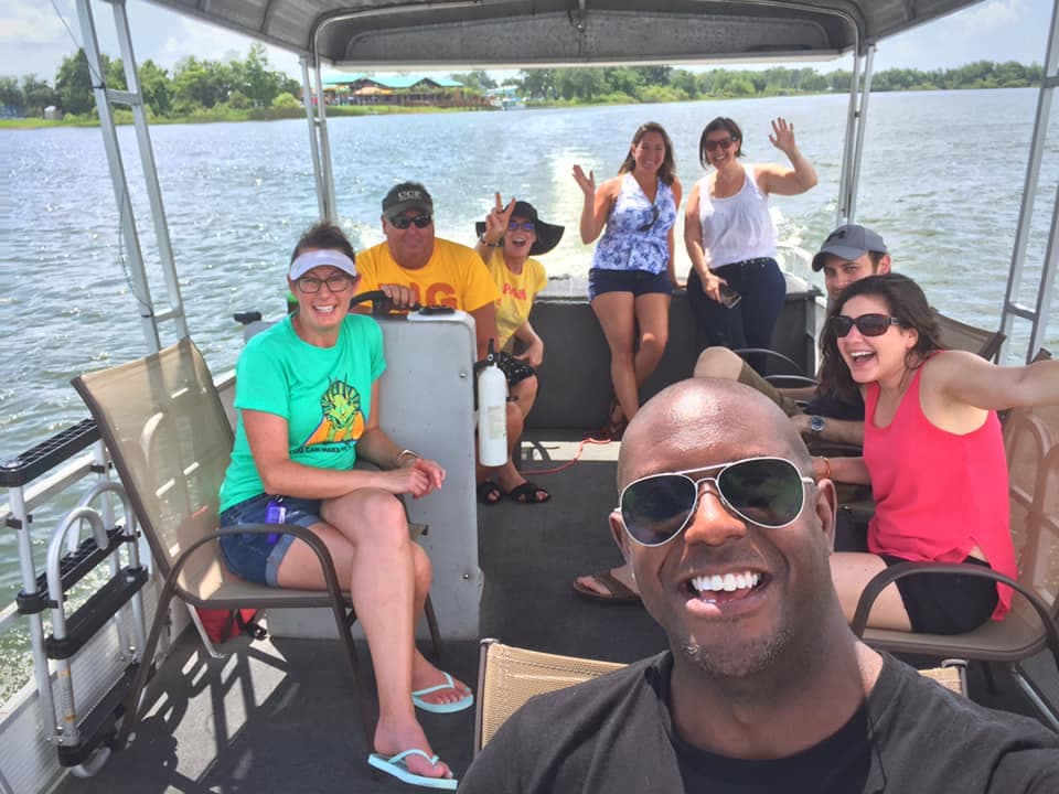 Family enjoying a pontoon boat ride on Lake Fairview